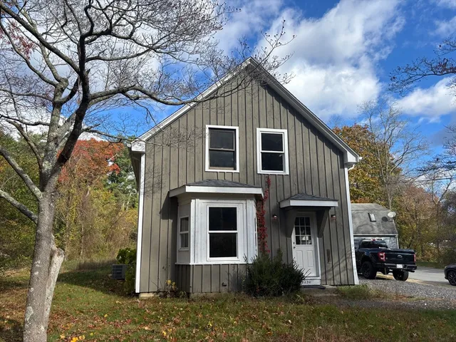 a view of a house with a yard