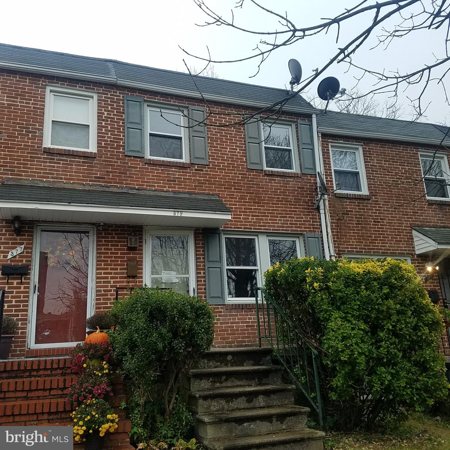 379 Marydell Road Baltimore, MD 21229 - Photo 2 of 14 a front view of a house with a garden
