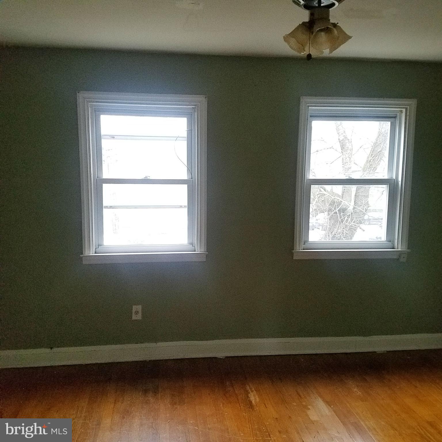 379 Marydell Road Baltimore, MD 21229 - Photo 13 of 14 a room with a window and wooden floor