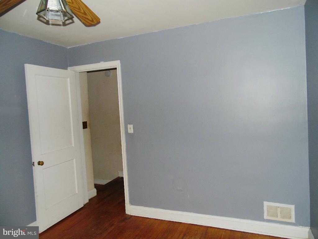 379 Marydell Road Baltimore, MD 21229 - Photo 10 of 14 a view of a hallway with wooden floor