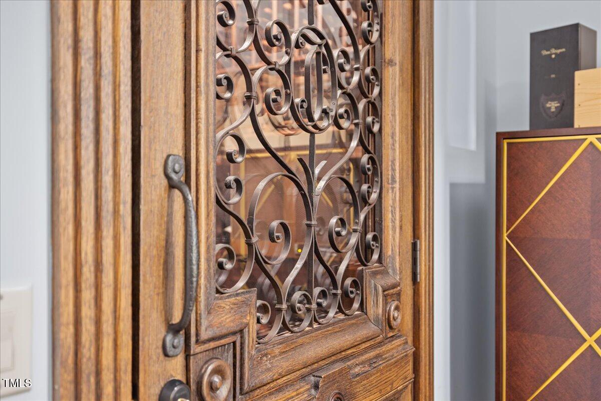 2627 Fairview Road Raleigh, NC 27608 - Photo 28 of 55 Custom Antique Door with iron accents to store your most precious wine collection