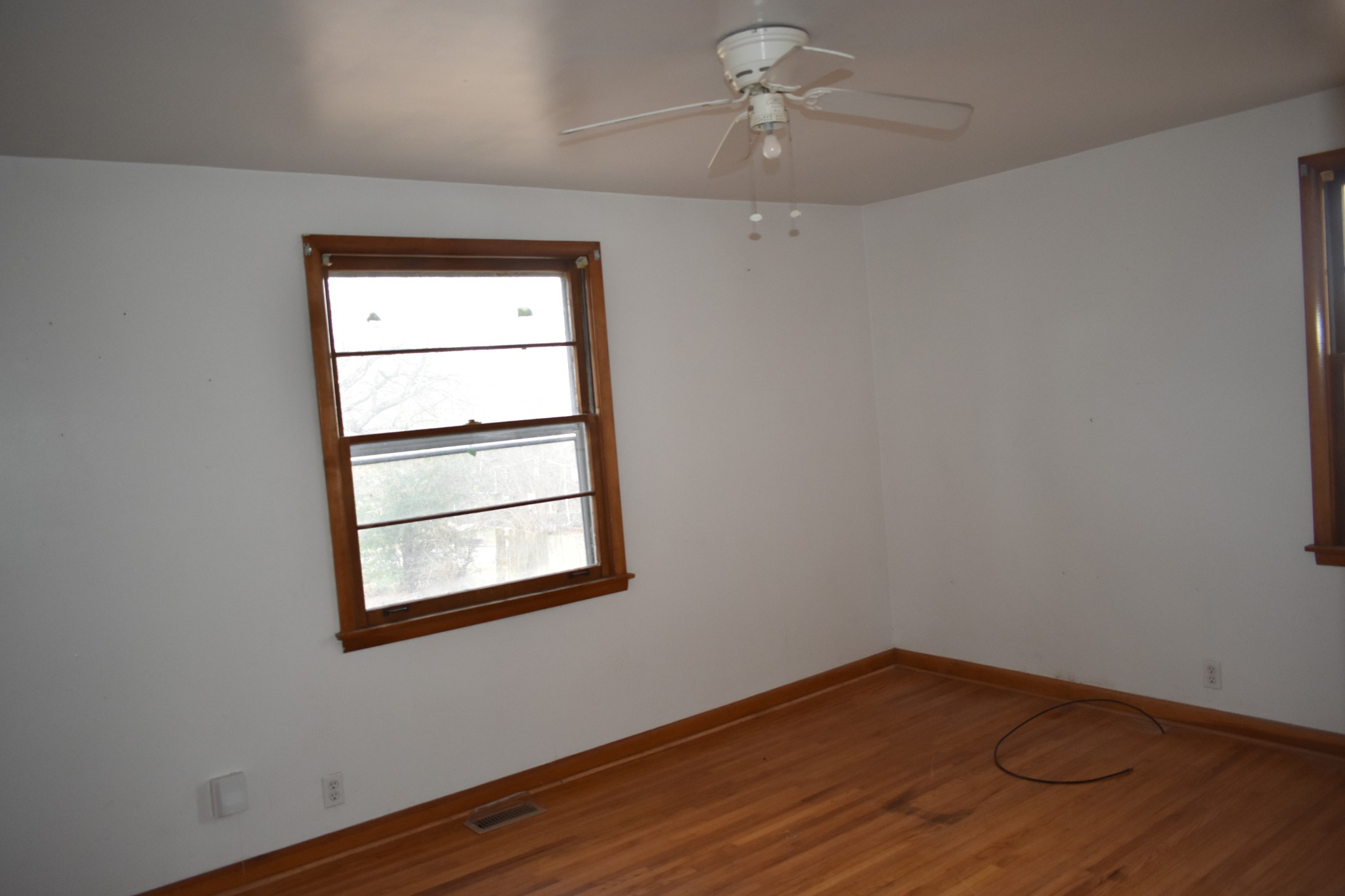 141 Hillcrest Drive Madison, TN 37115 - Photo 12 of 18 a view of empty room with wooden floor and fan