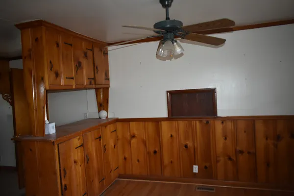 a kitchen with stainless steel appliances granite countertop cabinets and window