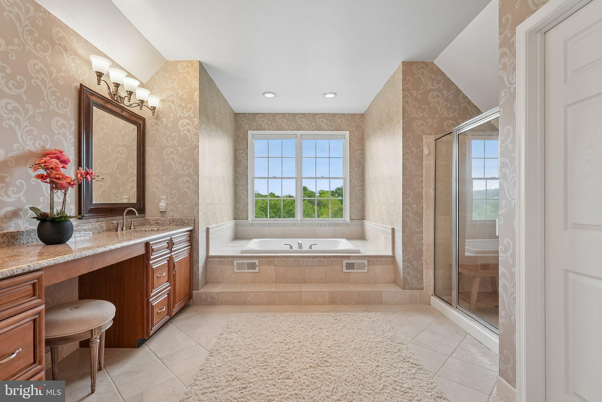 1 Baker Way Pennington, NJ 08534 - Photo 35 of 77 a bathroom with a granite countertop sink a large mirror and a bathtub next to a window
