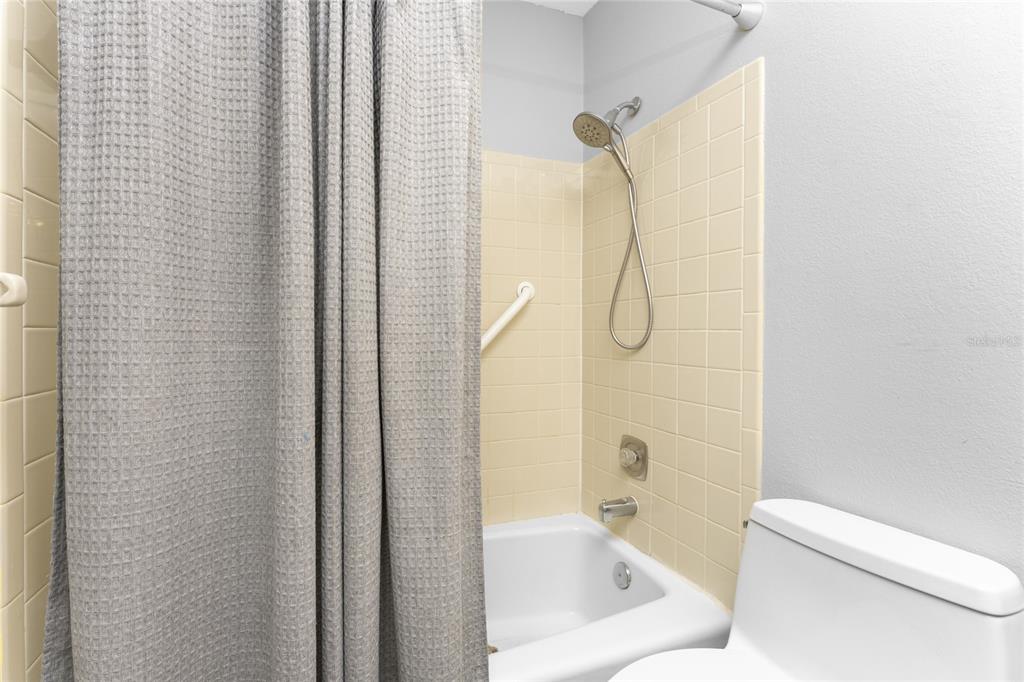 5041 North Beach Road, Unit 4A AND 4B Englewood, FL 34223 - Photo 26 of 75 a bathroom with a bathtub and shower