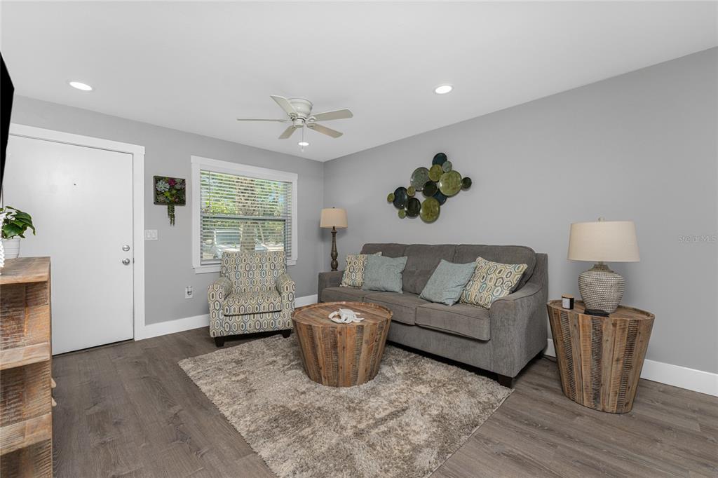 5041 North Beach Road, Unit 4A AND 4B Englewood, FL 34223 - Photo 48 of 75 a living room with furniture and a fireplace