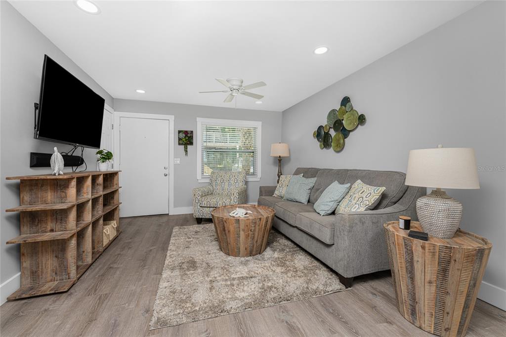 5041 North Beach Road, Unit 4A AND 4B Englewood, FL 34223 - Photo 49 of 75 a living room with furniture and a flat screen tv
