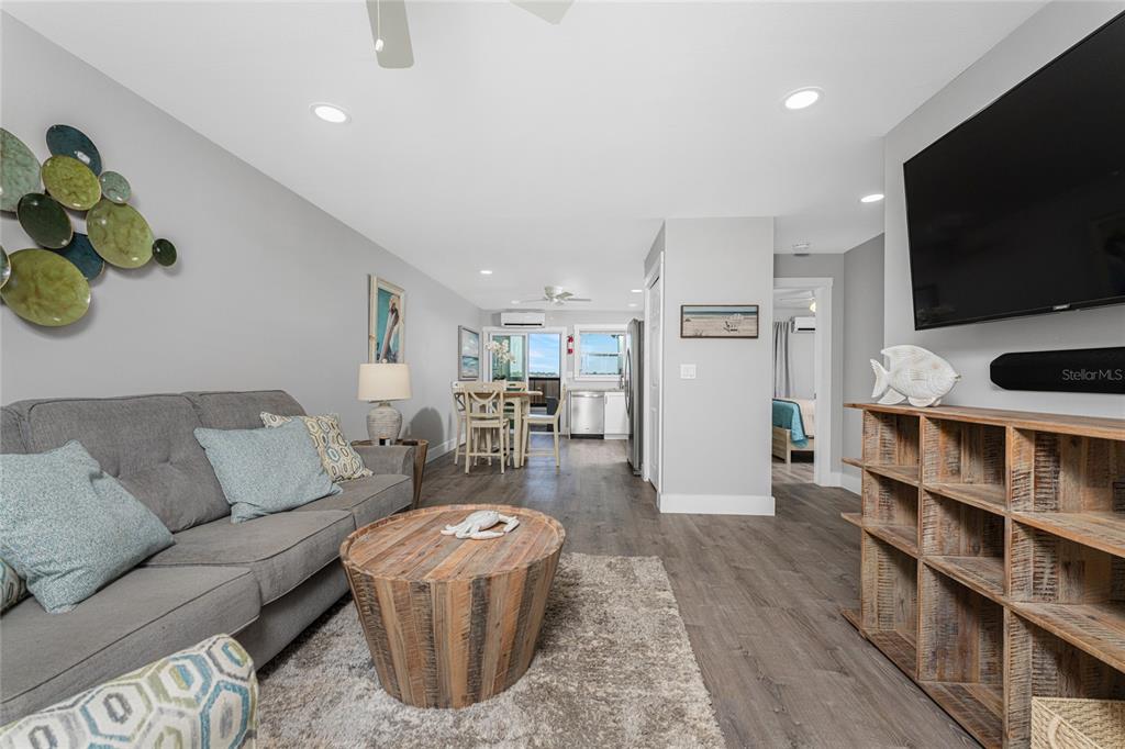 5041 North Beach Road, Unit 4A AND 4B Englewood, FL 34223 - Photo 52 of 75 a living room with furniture and a flat screen tv