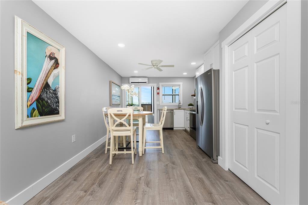 5041 North Beach Road, Unit 4A AND 4B Englewood, FL 34223 - Photo 53 of 75 a dining room with furniture and wooden floor