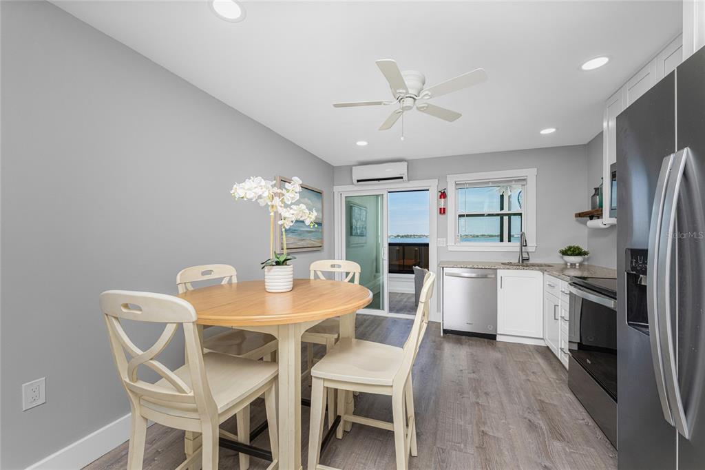 5041 North Beach Road, Unit 4A AND 4B Englewood, FL 34223 - Photo 55 of 75 a view of a dining room with furniture window and wooden floor