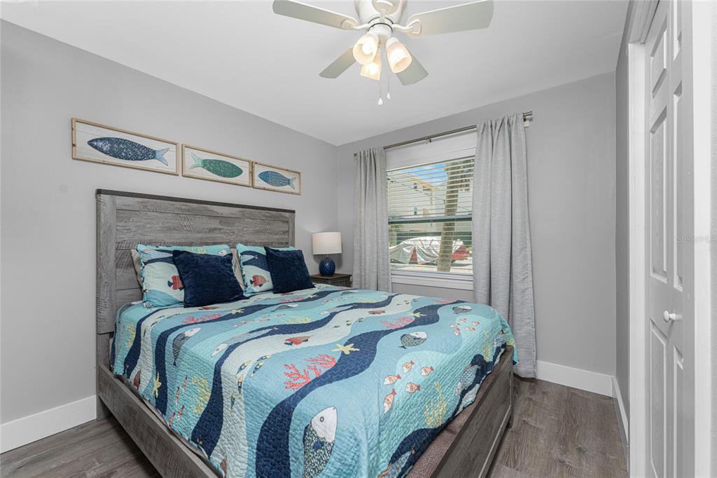 5041 North Beach Road, Unit 4A AND 4B Englewood, FL 34223 - Photo 66 of 75 a bedroom with a bed and a window