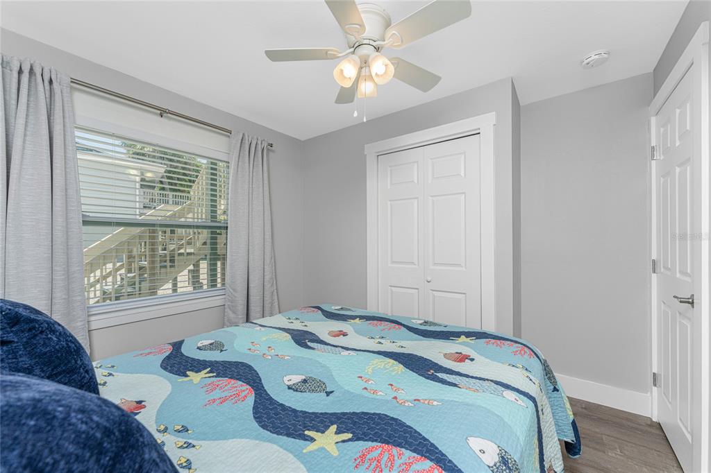 5041 North Beach Road, Unit 4A AND 4B Englewood, FL 34223 - Photo 67 of 75 a bedroom with a bed and a window
