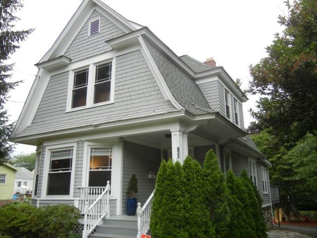 189 Toms Road Stamford, CT 06906 - Photo 1 of 1 a front view of a house with a yard