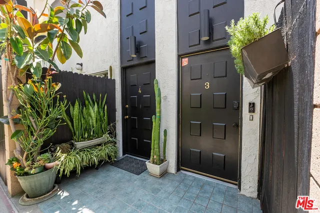 a view of a entryway with flower pots