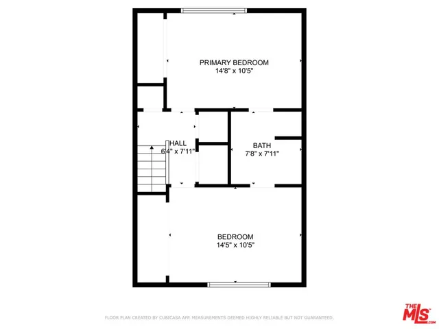 a picture of a bench in front of a wall