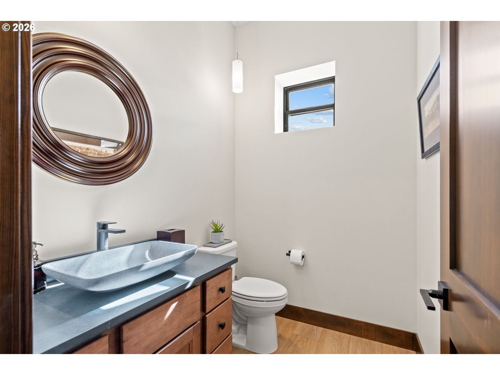 2106 Southwest Tahoe Avenue Pendleton, OR 97801 - Photo 19 of 48 a bathroom with a toilet a sink and a mirror