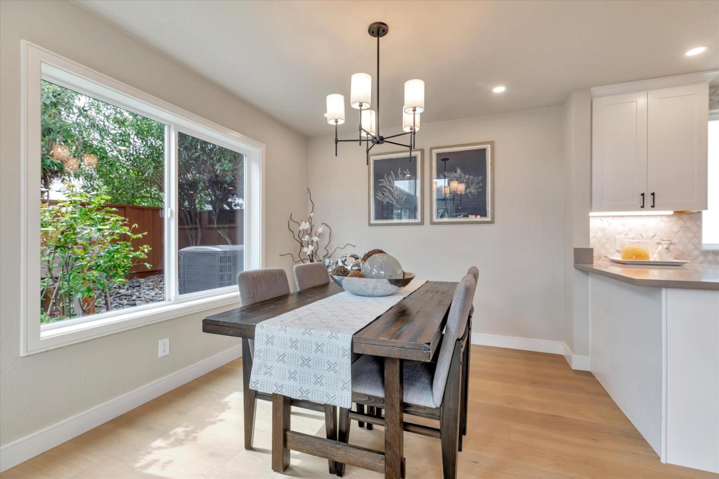 682 Ridgeview Terrace Fremont, CA 94536 - Photo 15 of 38 a dining room with furniture a chandelier and window