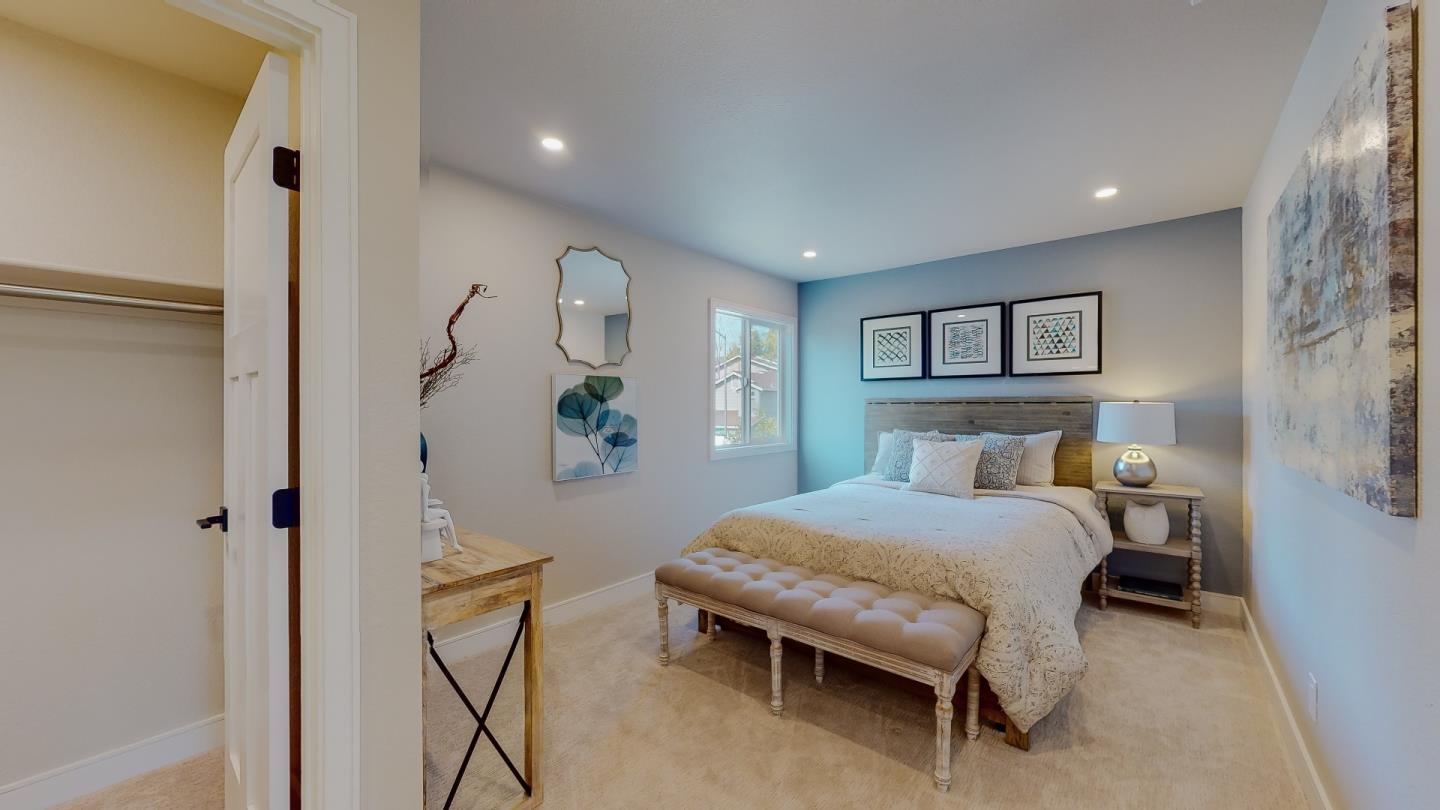 682 Ridgeview Terrace Fremont, CA 94536 - Photo 20 of 38 a bedroom with a bed and a table in it