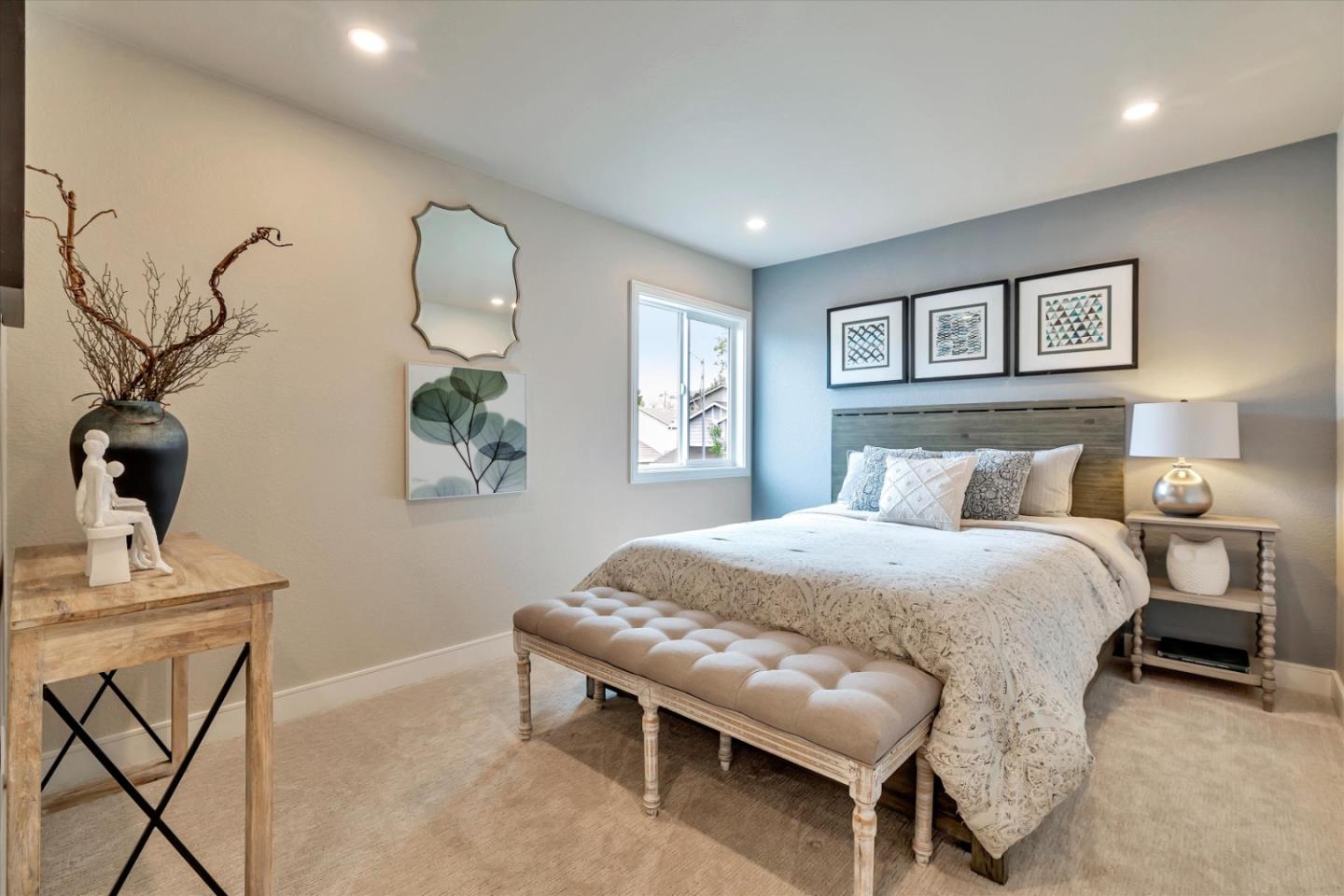 682 Ridgeview Terrace Fremont, CA 94536 - Photo 21 of 38 a bedroom with a bed and a table in it