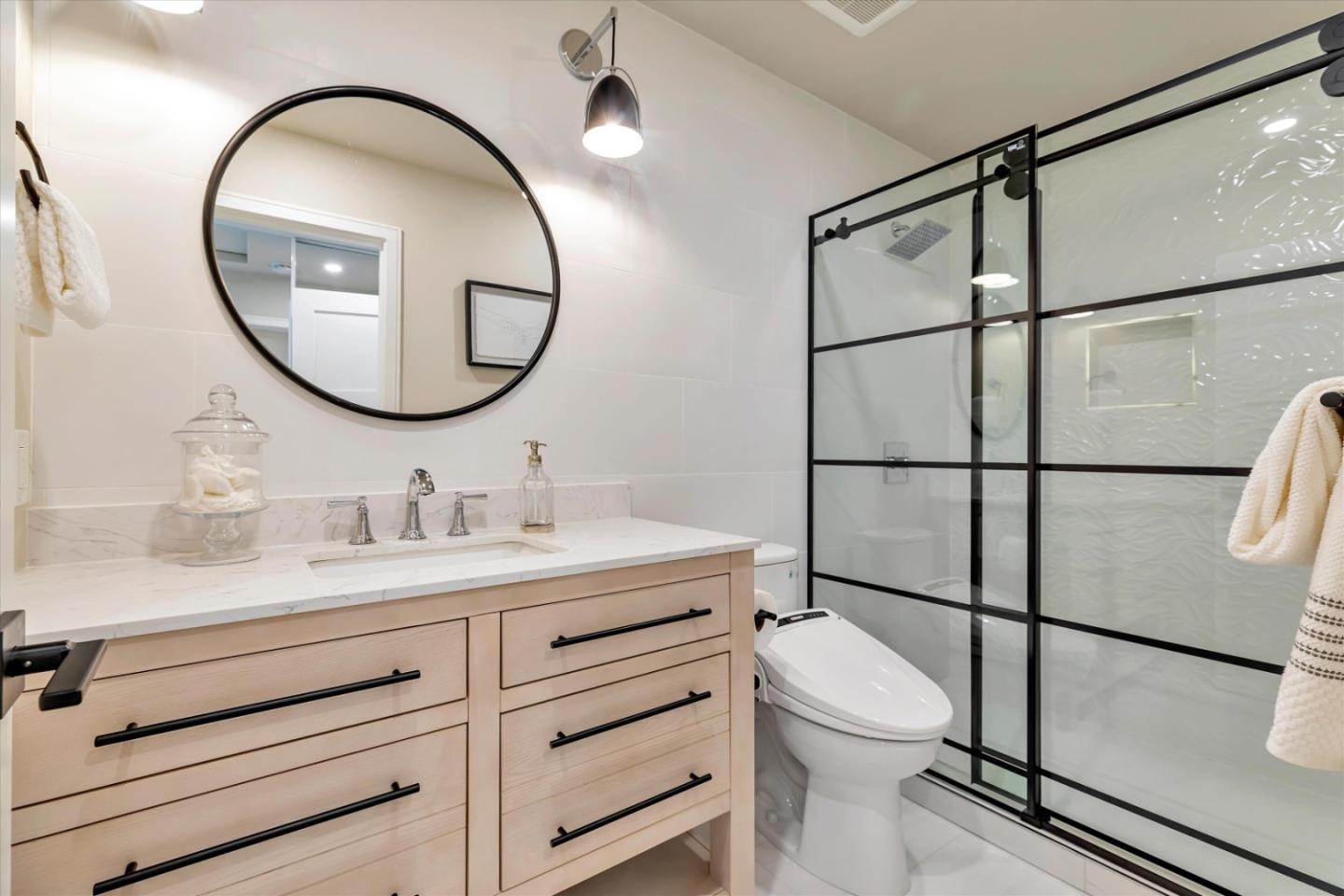 682 Ridgeview Terrace Fremont, CA 94536 - Photo 26 of 38 a bathroom with a toilet a sink and a mirror