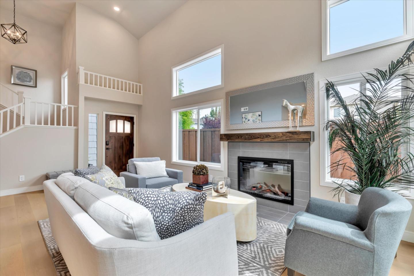 682 Ridgeview Terrace Fremont, CA 94536 - Photo 6 of 38 a living room with furniture and a fireplace