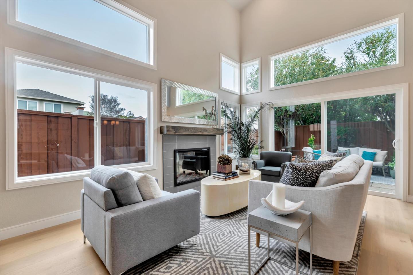 682 Ridgeview Terrace Fremont, CA 94536 - Photo 8 of 38 a living room with furniture a fireplace and a large window