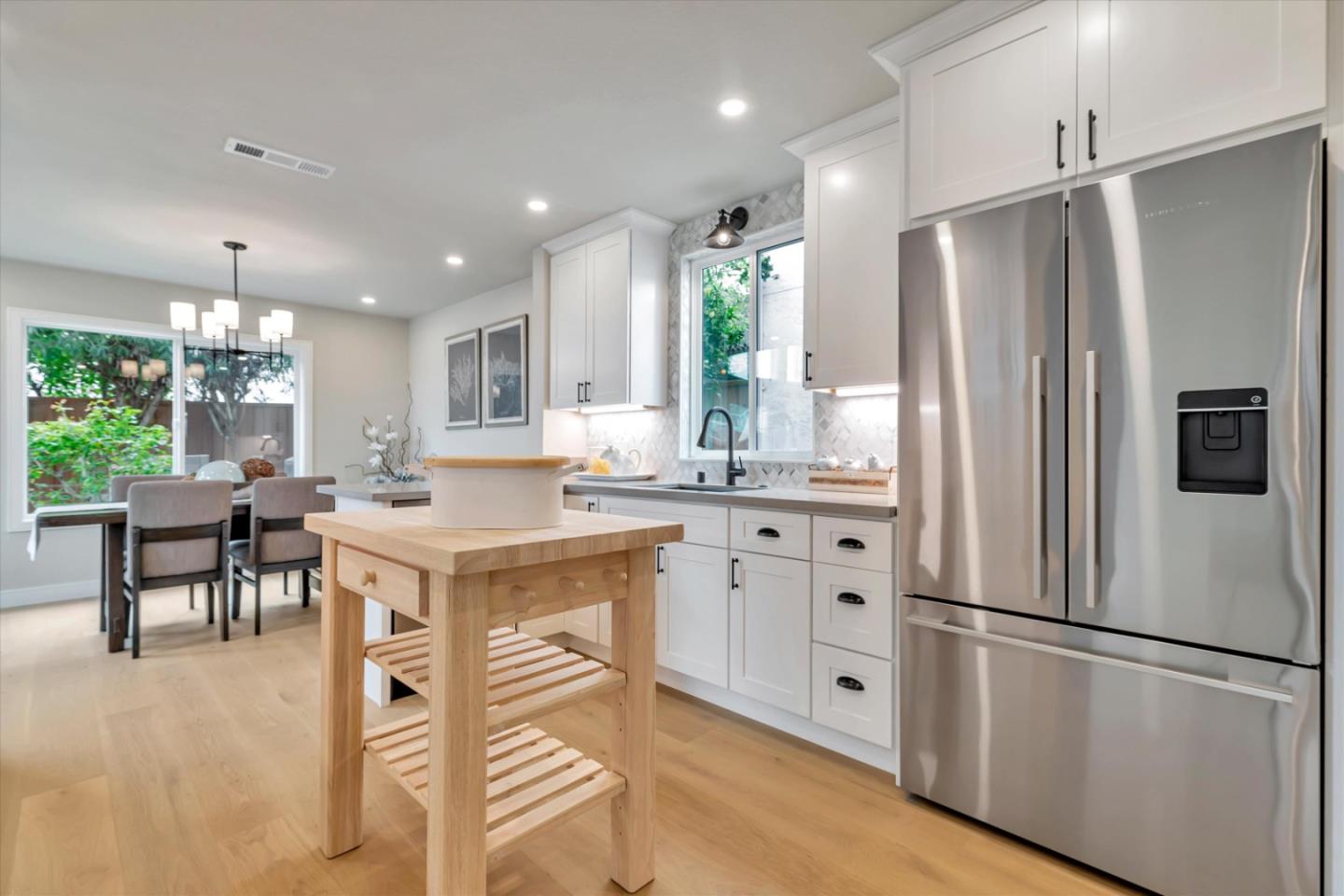 682 Ridgeview Terrace Fremont, CA 94536 - Photo 9 of 38 a kitchen with stainless steel appliances a refrigerator a table and chairs