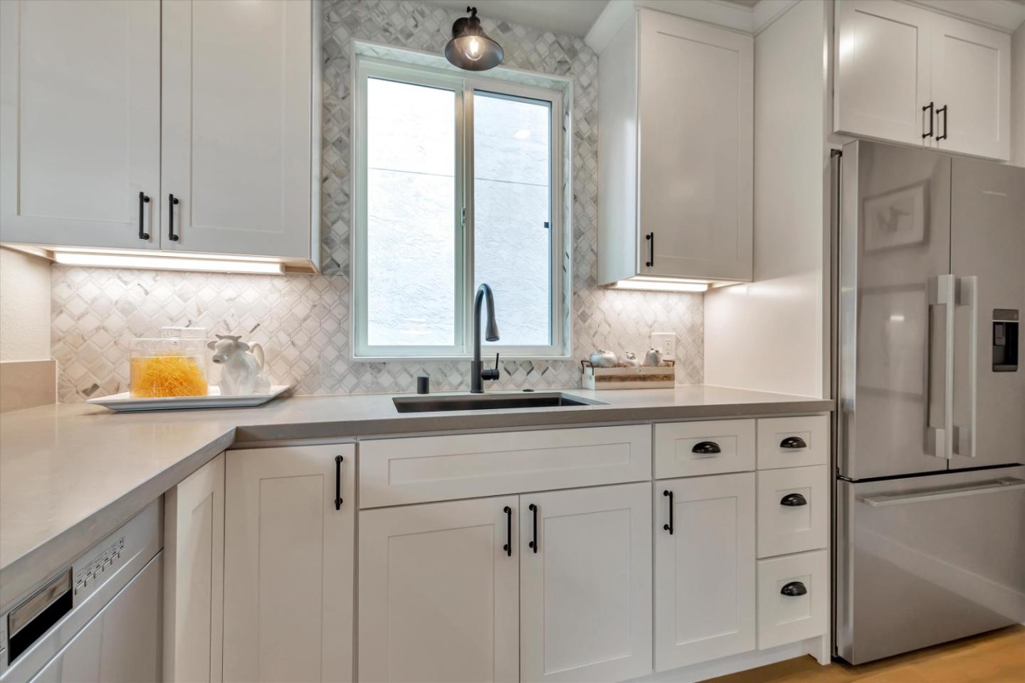 682 Ridgeview Terrace Fremont, CA 94536 - Photo 10 of 38 a kitchen with stainless steel appliances white cabinets and a window