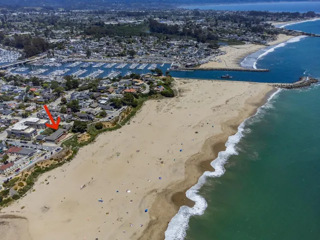 an aerial view of beach and ocean