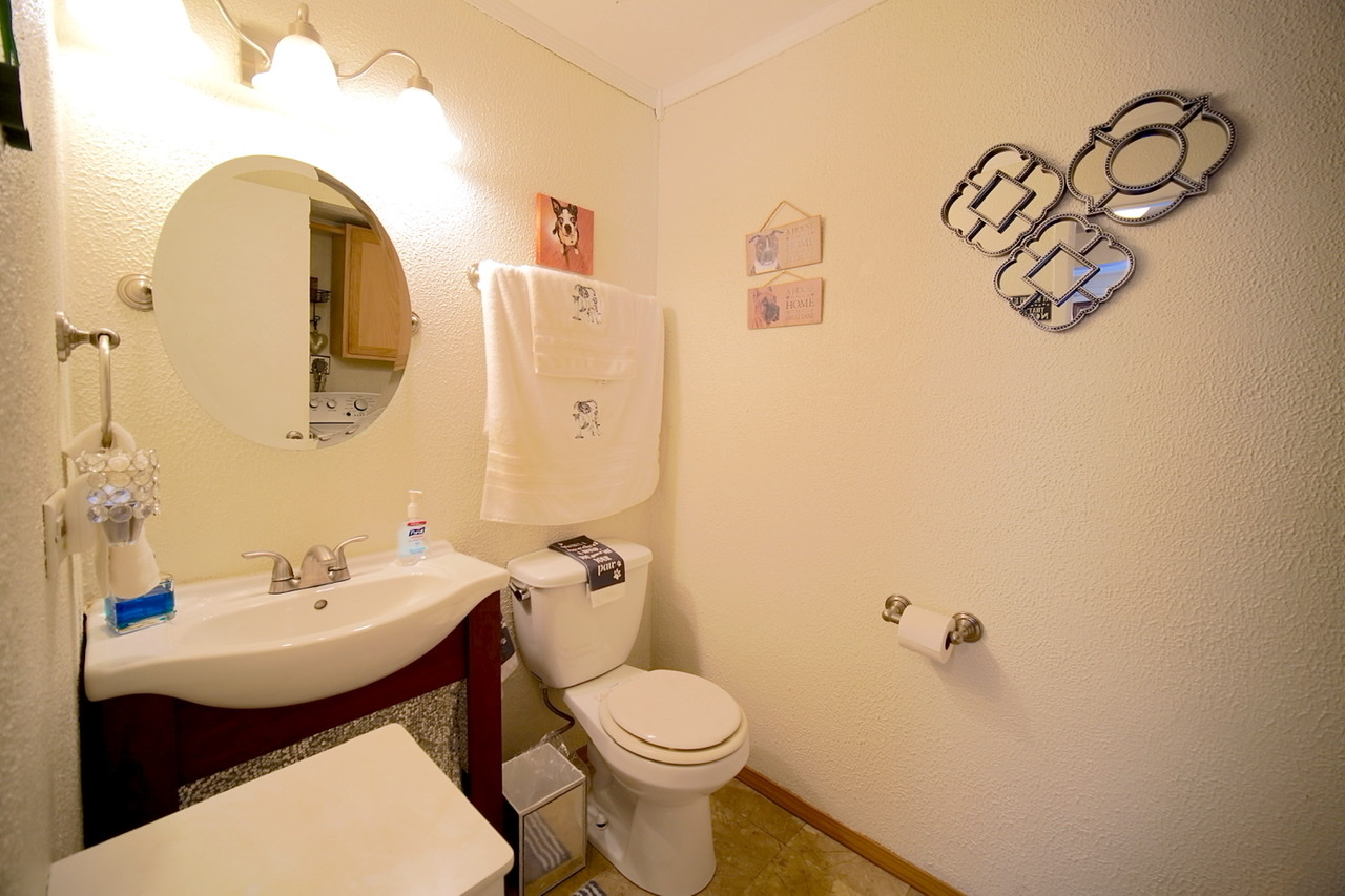 9835 South Harlem Avenue, Unit S Chicago Ridge, IL 60415 - Photo 16 of 17 a bathroom with a toilet sink and mirror