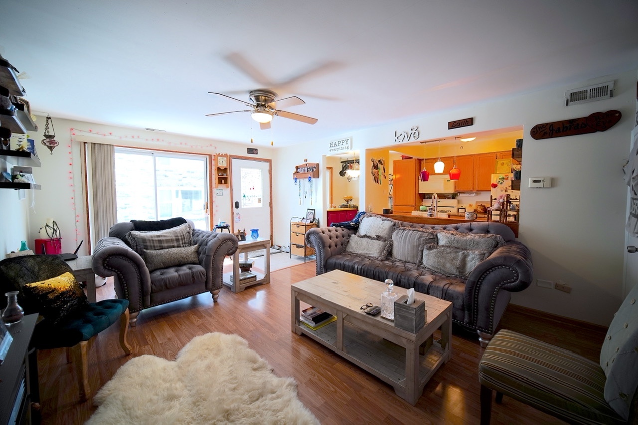 9835 South Harlem Avenue, Unit S Chicago Ridge, IL 60415 - Photo 6 of 17 a living room with furniture and a flat screen tv