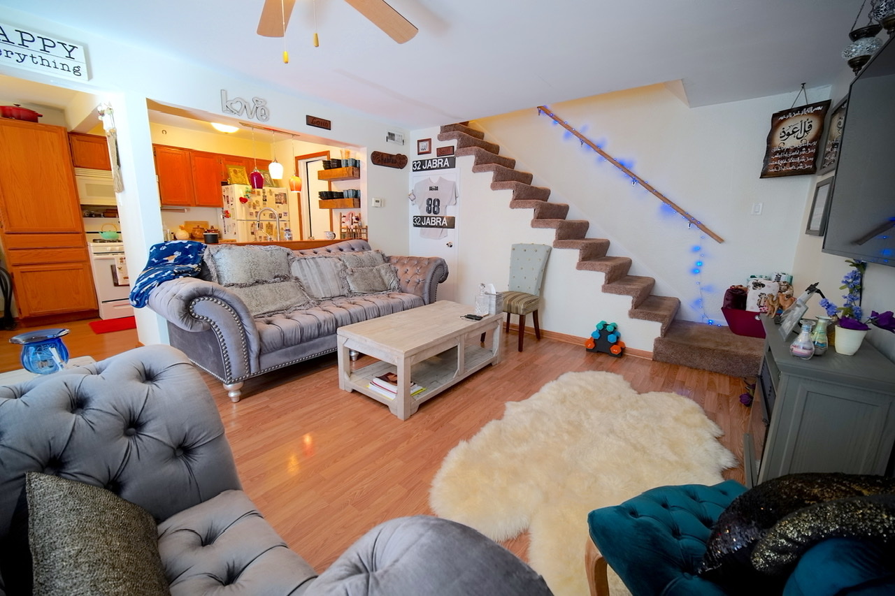 9835 South Harlem Avenue, Unit S Chicago Ridge, IL 60415 - Photo 8 of 17 a living room with furniture and a large window