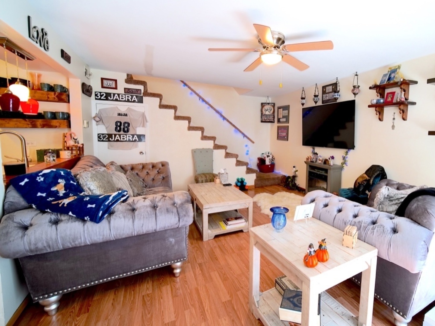 9835 South Harlem Avenue, Unit S Chicago Ridge, IL 60415 - Photo 9 of 17 a living room with furniture and a flat screen tv