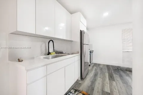a bathroom with a sink and mirror