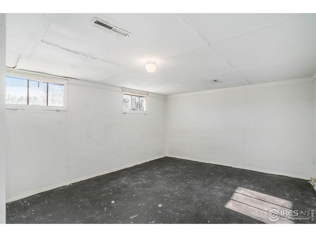 945 East Prospect Road Fort Collins, CO 80525 - Photo 9 of 15 Lower Level Rec Room/Non Conforming Bedroom