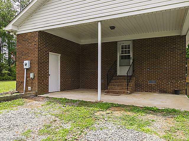 1460 Miles Chapel Road Mebane, NC 27302 - Photo 2 of 16 Exterior Front. Side of Home/ Carport