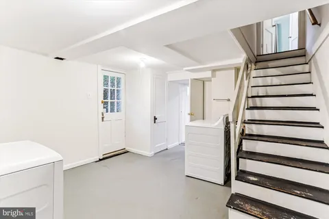a view of entryway with stairs and wooden floor
