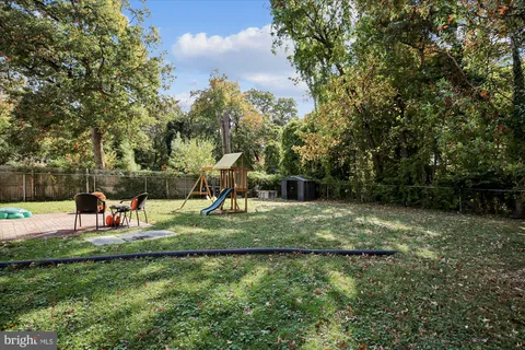 a picture of a bench in front of a window