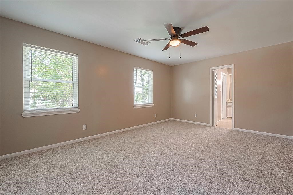 6534 Bayonne Drive Spring, TX 77389 - Photo 13 of 15 a view of an empty room with a window