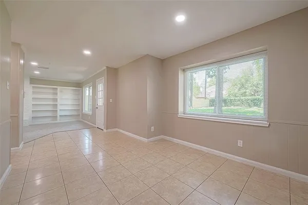 a view of an empty room with a window