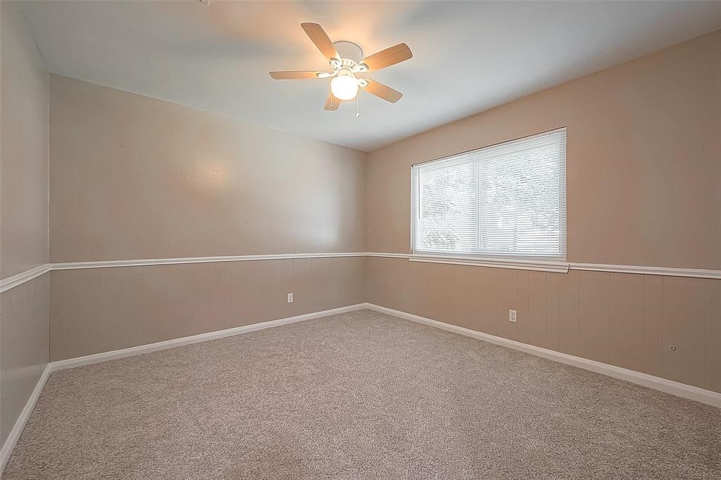 6534 Bayonne Drive Spring, TX 77389 - Photo 9 of 15 an empty room with a window and a fan