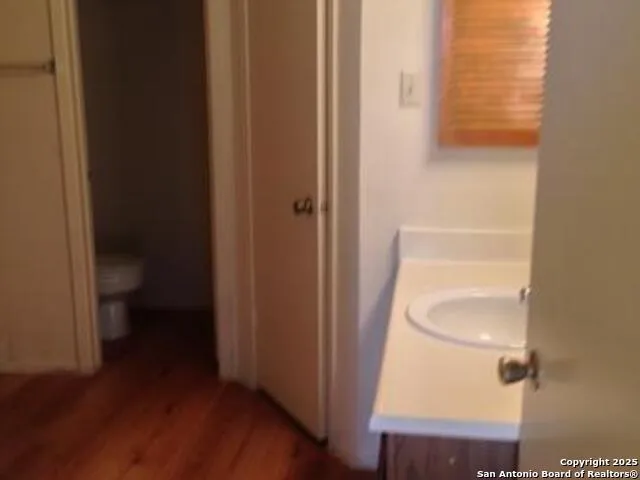 a bathroom view of a toilet and a sink