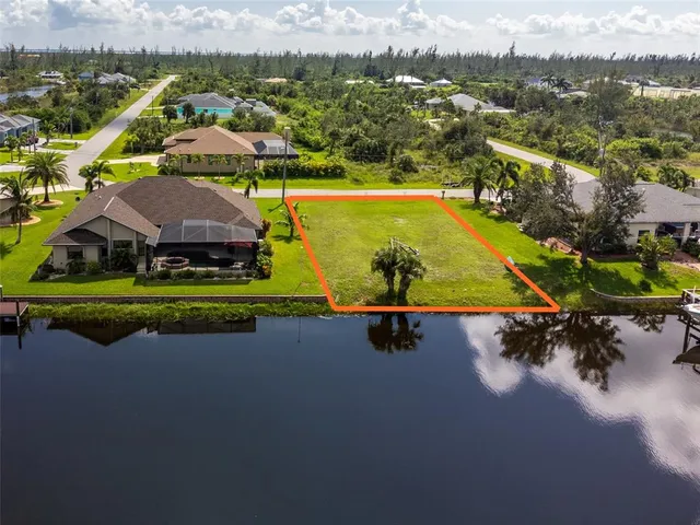 an aerial view of a house with a swimming pool