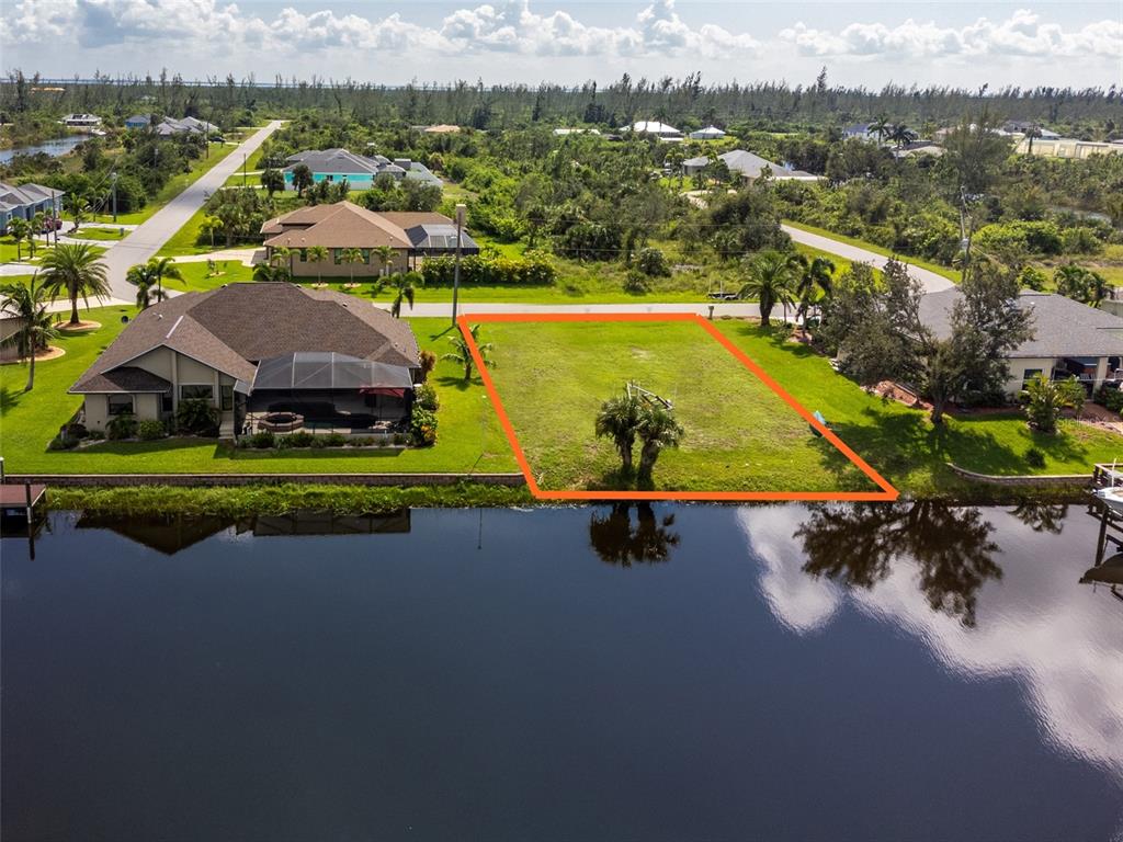 15666 Stuart Circle Port Charlotte, FL 33981 - Photo 2 of 7 an aerial view of a house with a swimming pool