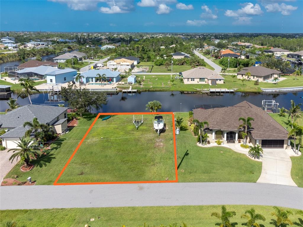 15666 Stuart Circle Port Charlotte, FL 33981 - Photo 5 of 7 an aerial view of residential houses with outdoor space