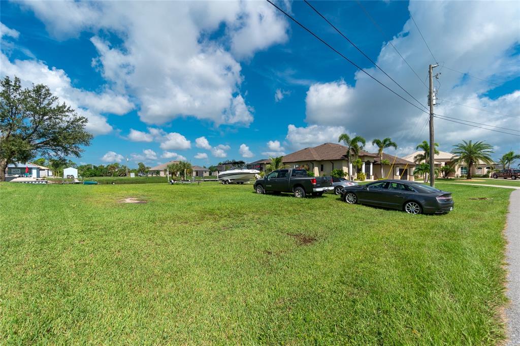 15666 Stuart Circle Port Charlotte, FL 33981 - Photo 6 of 7 a front view of a house with garden