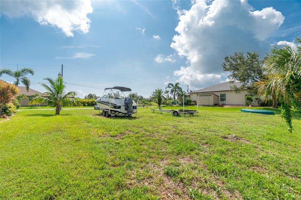 15666 Stuart Circle Port Charlotte, FL 33981 - Photo 7 of 7 a front view of a house with garden
