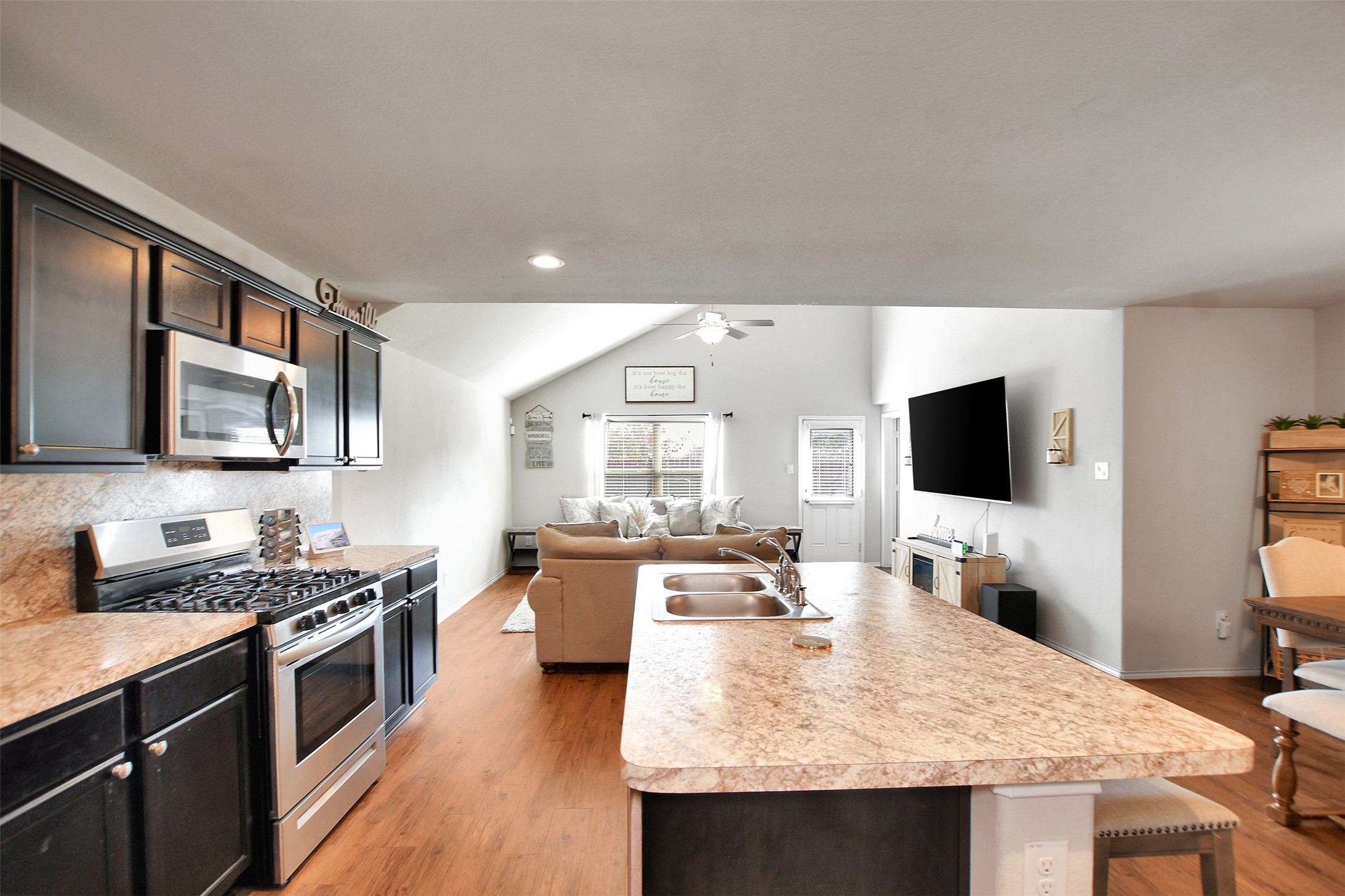 1022 Rancho Grande Drive Channelview, TX 77530 - Photo 14 of 36 a large kitchen with a stove and a flat screen tv