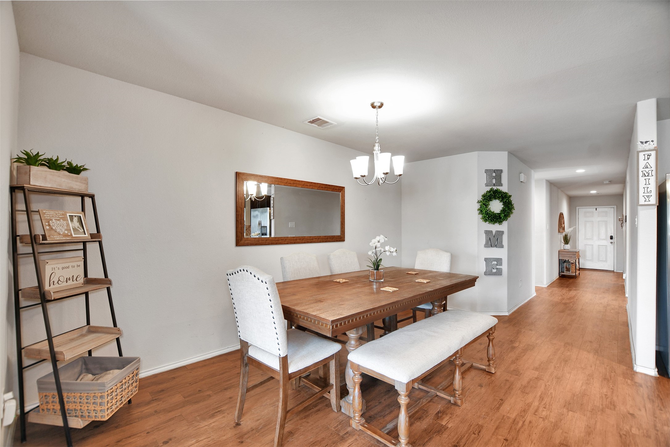 1022 Rancho Grande Drive Channelview, TX 77530 - Photo 16 of 36 a view of a dining room with furniture and wooden floor