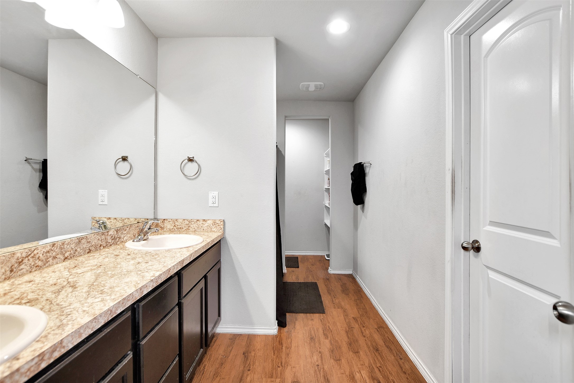1022 Rancho Grande Drive Channelview, TX 77530 - Photo 25 of 36 a spacious bathroom with a granite countertop sink and a mirror